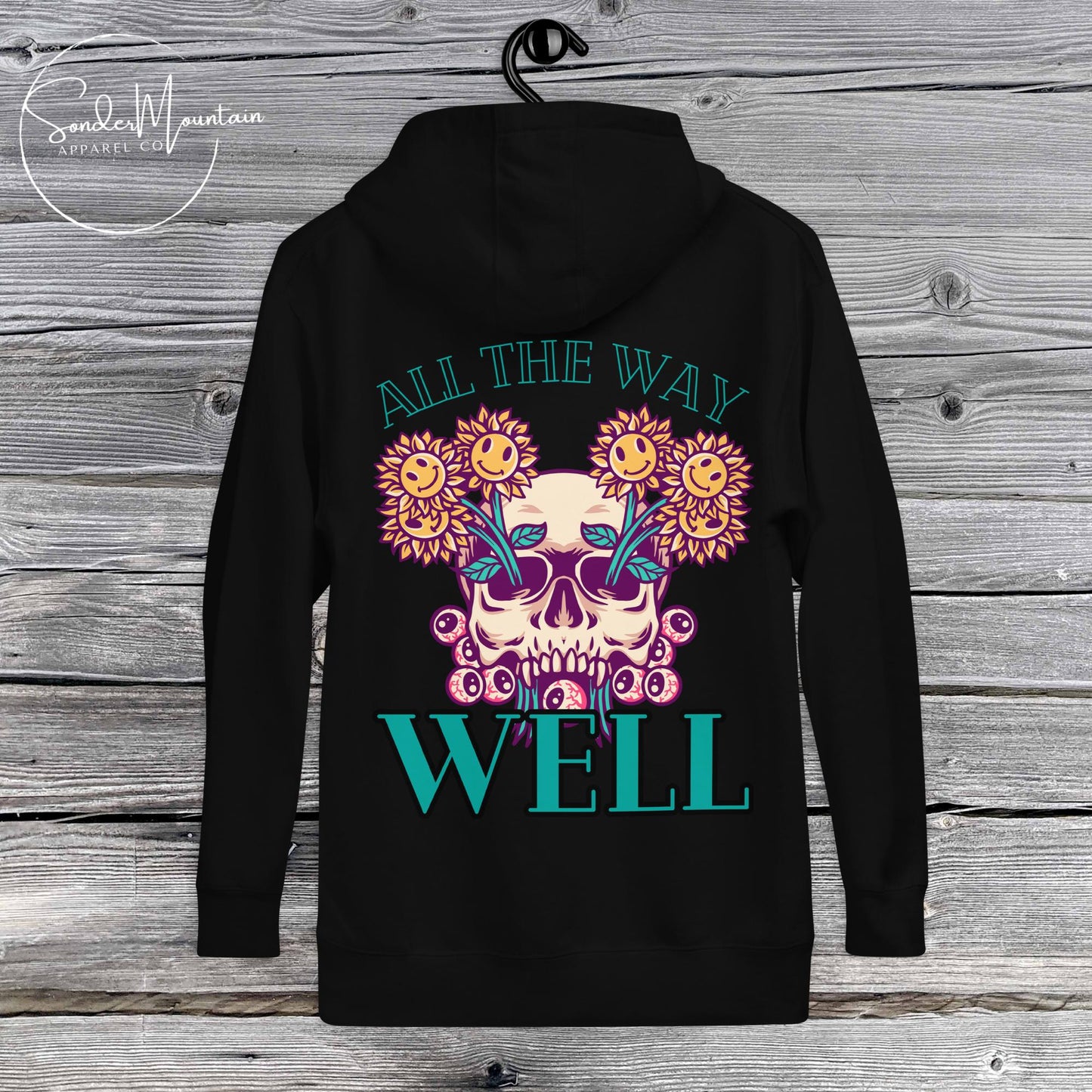 Unisex tattoo-inspired “Let It Grow” hoodie featuring a blooming skull graphic, 100% cotton face with 65% ring-spun cotton and 35% polyester for warmth and durability, front pouch pocket, self-fabric back patch, matching flat drawstrings, and 3-panel hood for a signature relaxed fit.