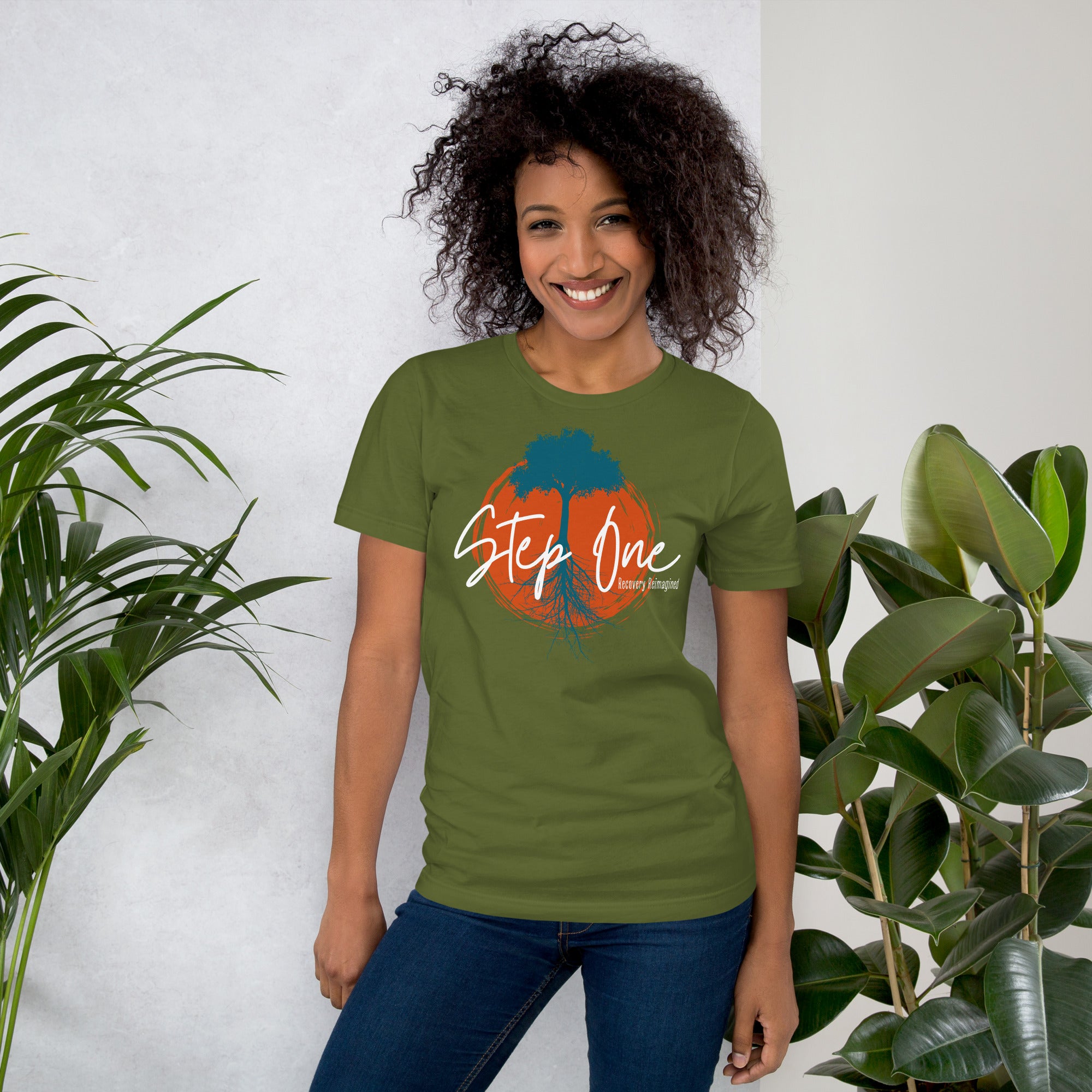 Unisex cotton t-shirt featuring tattoo-inspired “Step One” graphic with rooted artwork, soft lightweight fabric, pre-shrunk fit, side-seamed construction, and sustainable made-to-order design supporting mental health and addiction recovery.