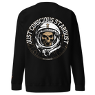 A black sweatshirt with a graphic print of a skull wearing a space helmet and the text 'JUST CONSCIOUS STARDUST'.